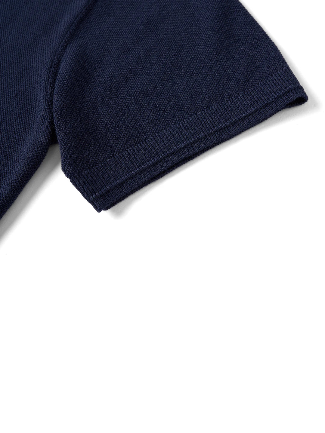 Navy blue knit short sleeve with ribbed cuff, stylish everyday essential