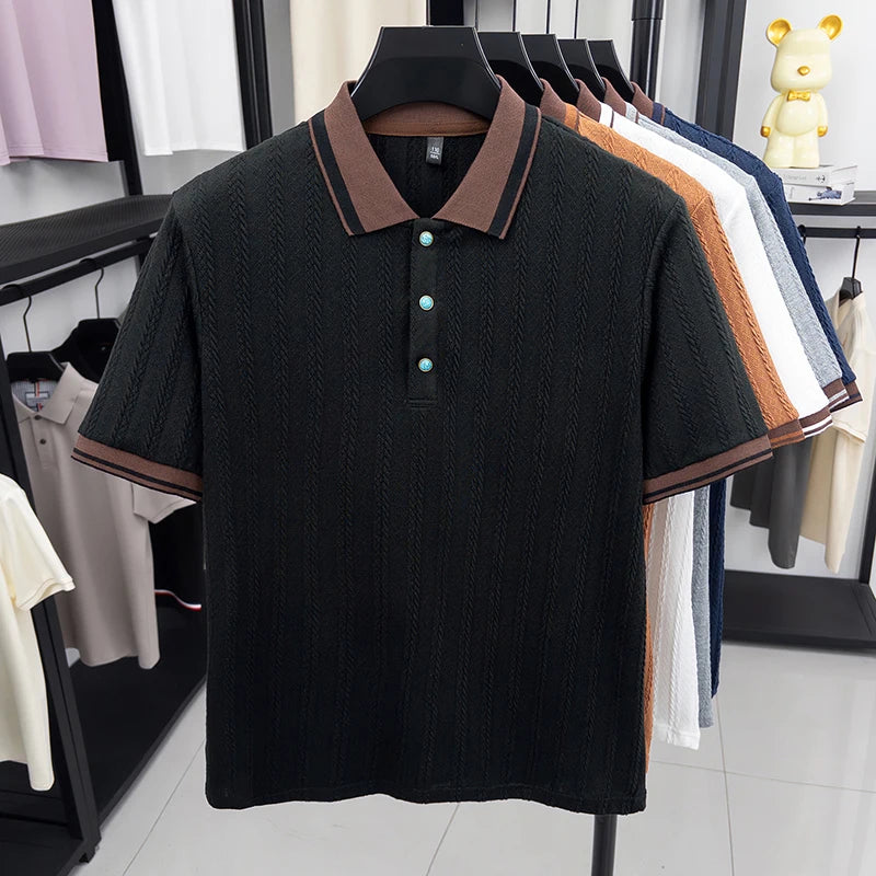 Black textured polo shirt with contrast collar, displayed on hanger in retail store